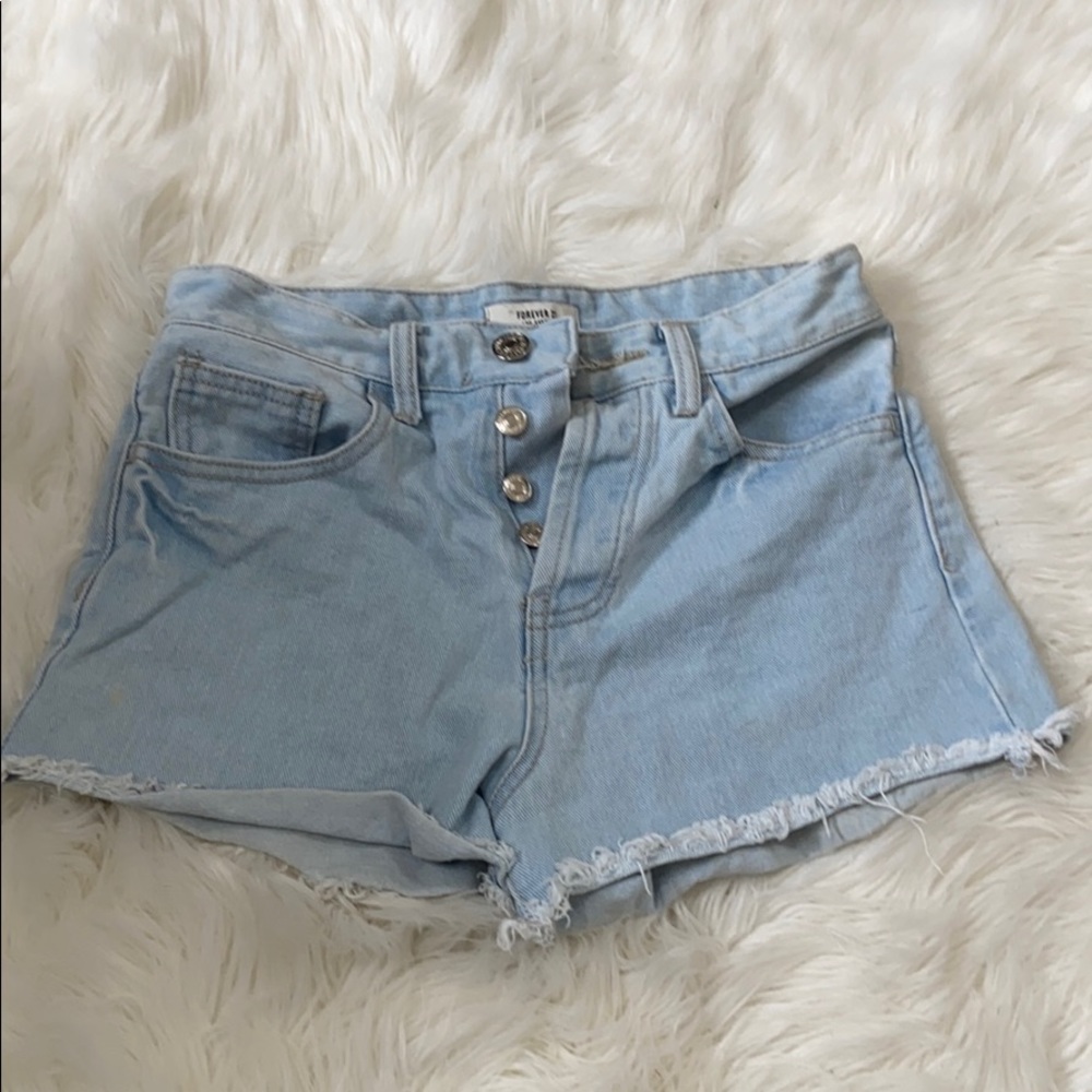 High waisted blue jean shorts destressed bottom